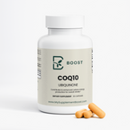 CoQ10 Ubiquinone bottle with a few capsules beside it