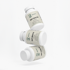 Several Gut Health bottles stacked at angles on a plain background