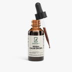 Reishi Calm Drops bottle with the glass dropper lifted out
